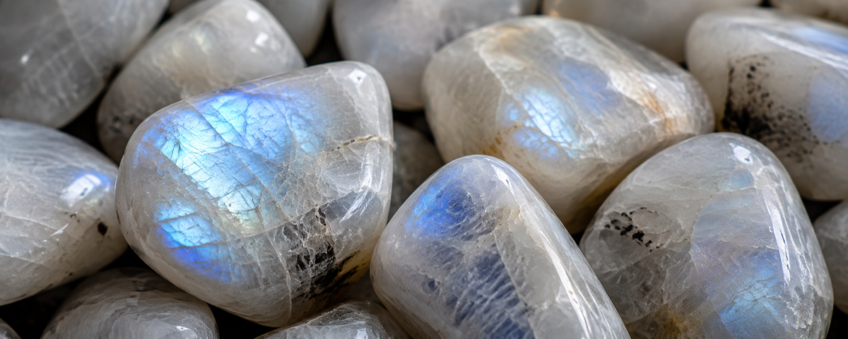 Moonstone, also known as larvikite, a large block in the water in front of a waterfall